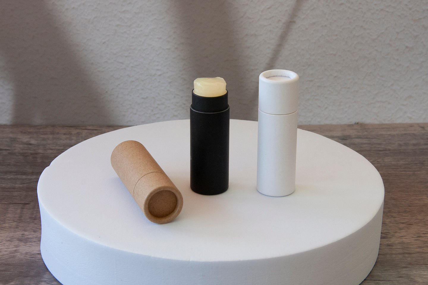 Group of three sustainable push-up paper lip balm tubes, plastic-free and biodegradable